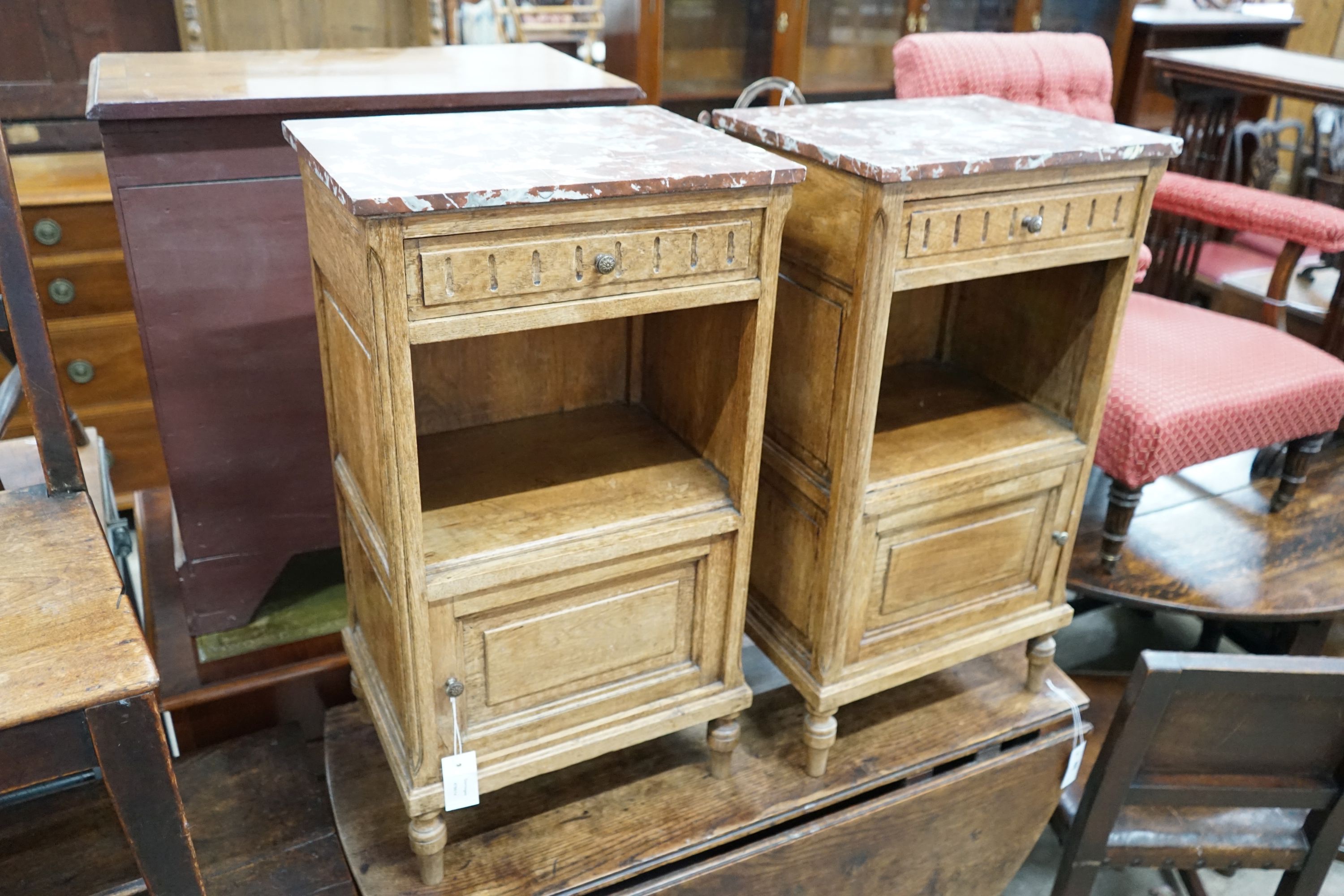 A pair of late 19th / early 20th century French oak marble topped bedside cabinets, width 43cm, depth 33cm, height 79cm